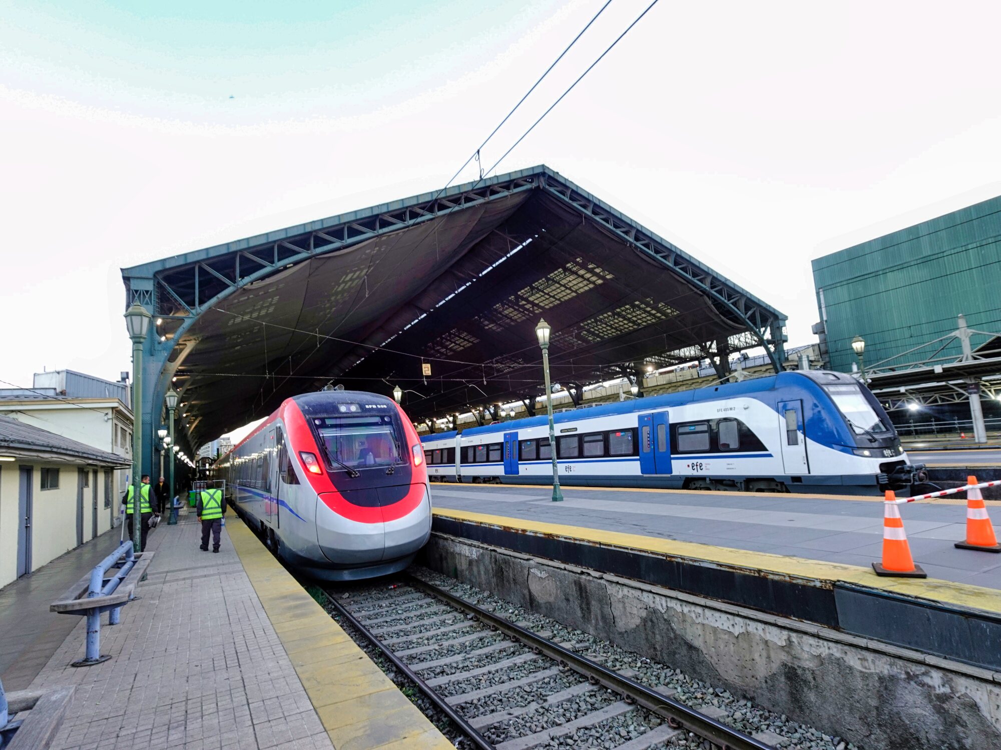 The sleek new BMU train preparing for departure under the historic canopy of Santiago’s Alameda Station.