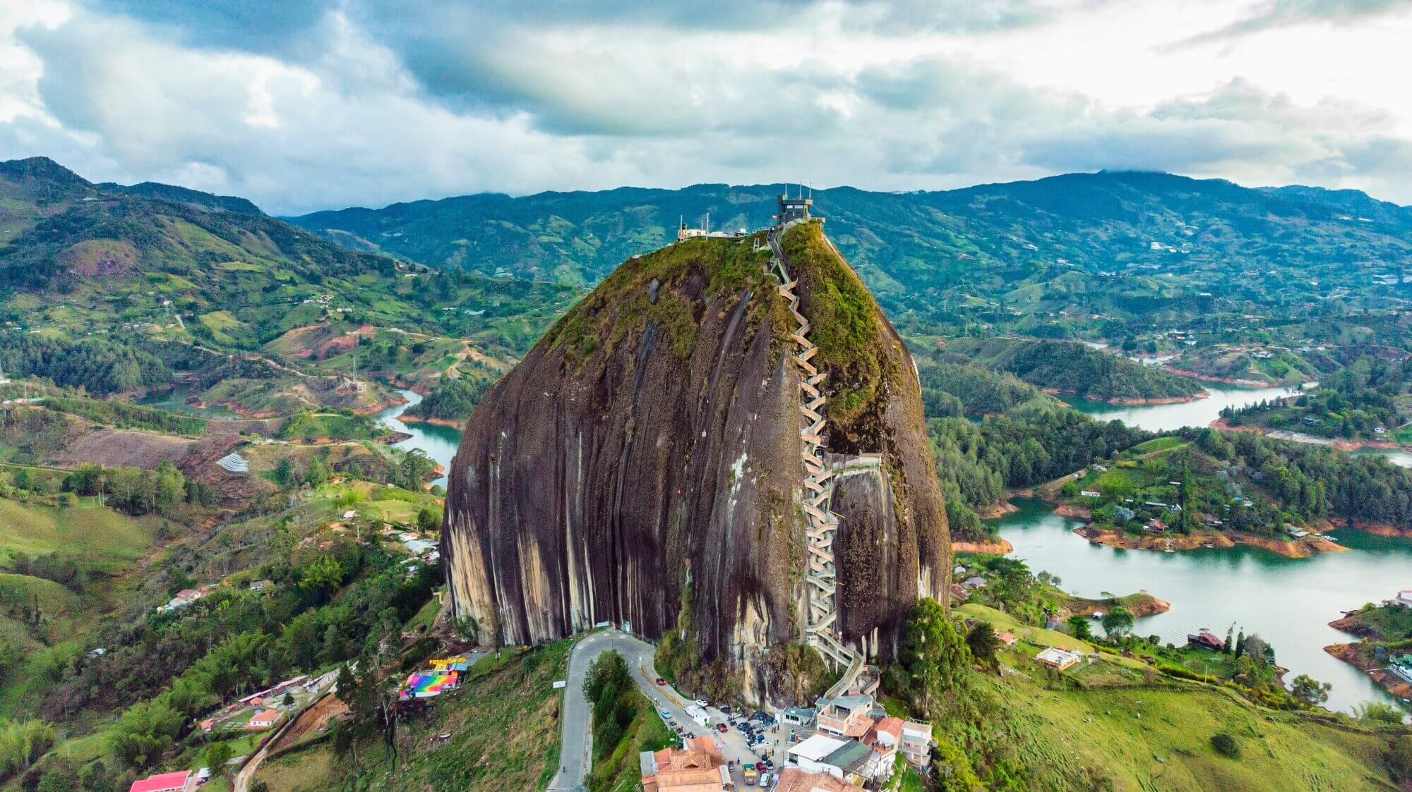 El Peñol rock overlooking the lakes and green countryside of Guatapé, Colombia.
