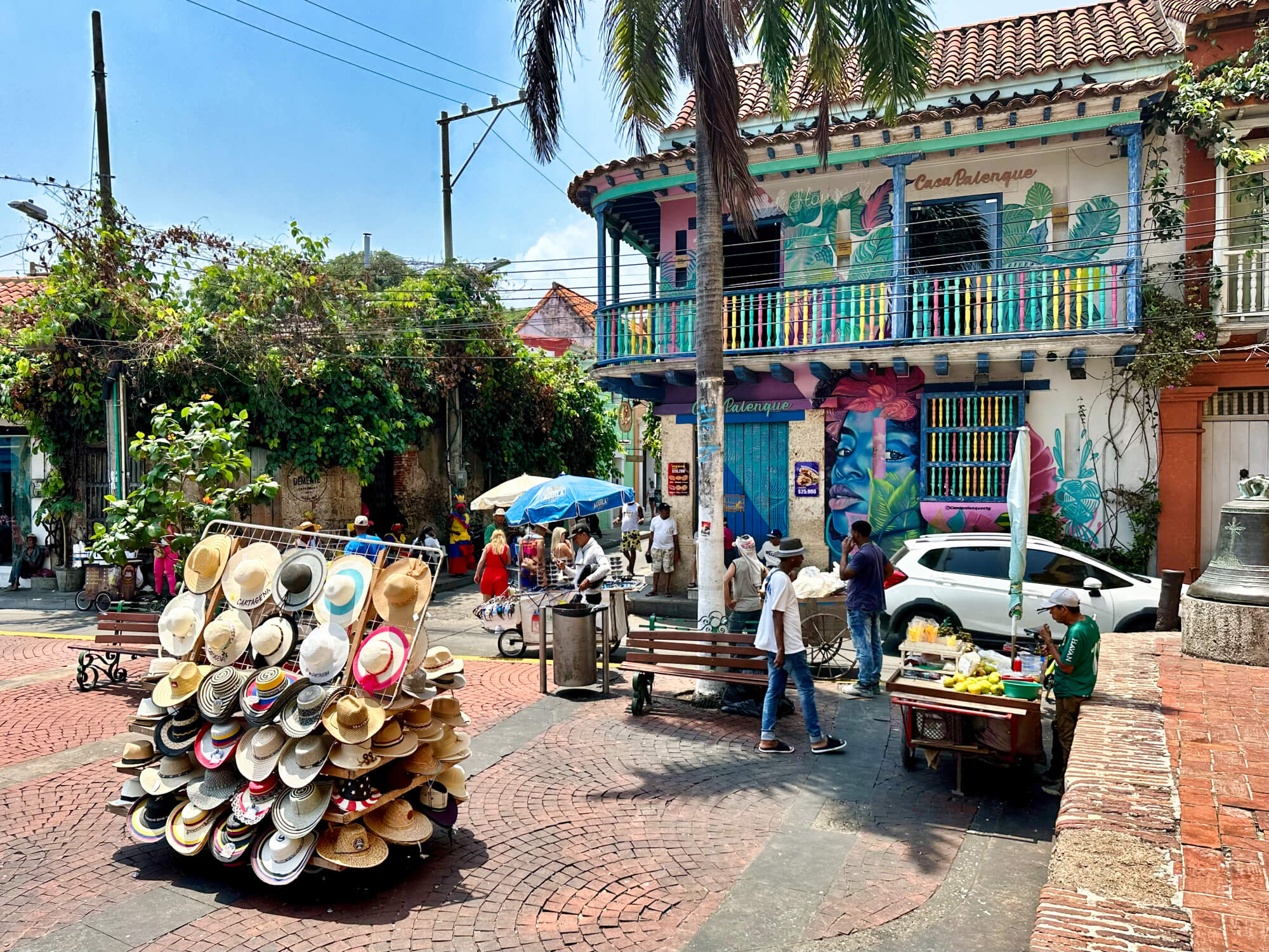 Colorful colonial buildings and street life in Getsemaní, Cartagena, Colombia.