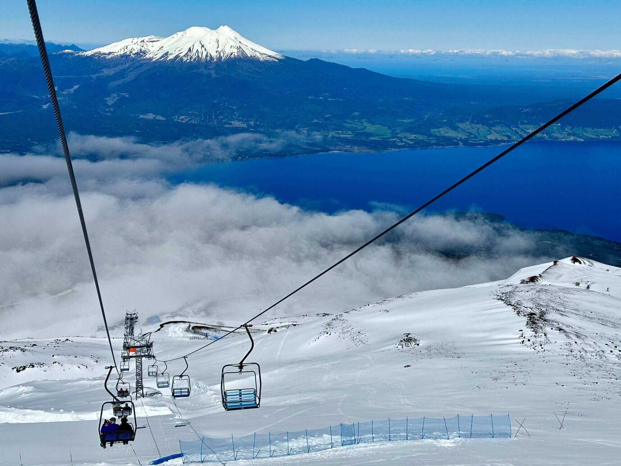 View from Osorno Volcano across Lake Llanquihue and the snow-covered mountains of southern Chile.