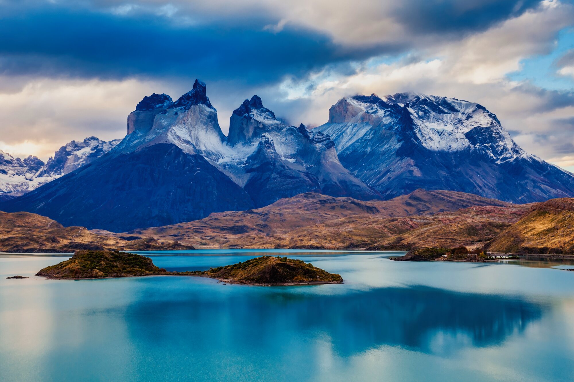 Granite mountains and turquoise lake in Torres del Paine National Park, Chilean Patagonia.