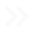 Double chevron symbols pointing to the right.