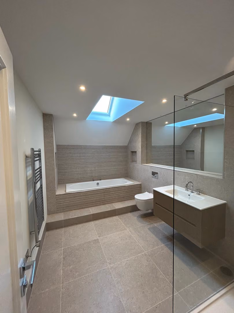 a bathroom with a shower and a tub