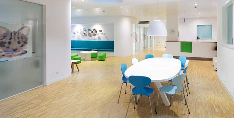 The lobby and waiting room of a hospital that looks very welcoming.