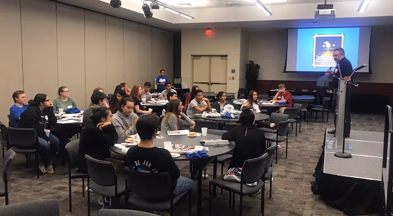 Mentor speaking to a group of students