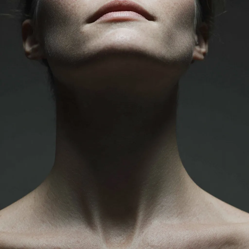 Close-up of the back of the neck and shoulders, chiropractic care for neck pain in Central, Hong Kong