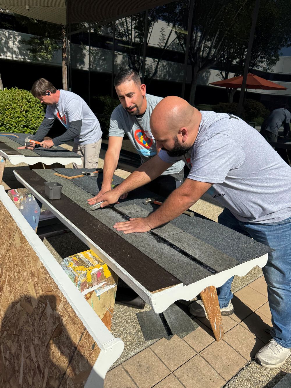 Technical Builders employees outside in front of our office in San Jose, CA working on building a playhouse for children in need for Habitat for Humanity