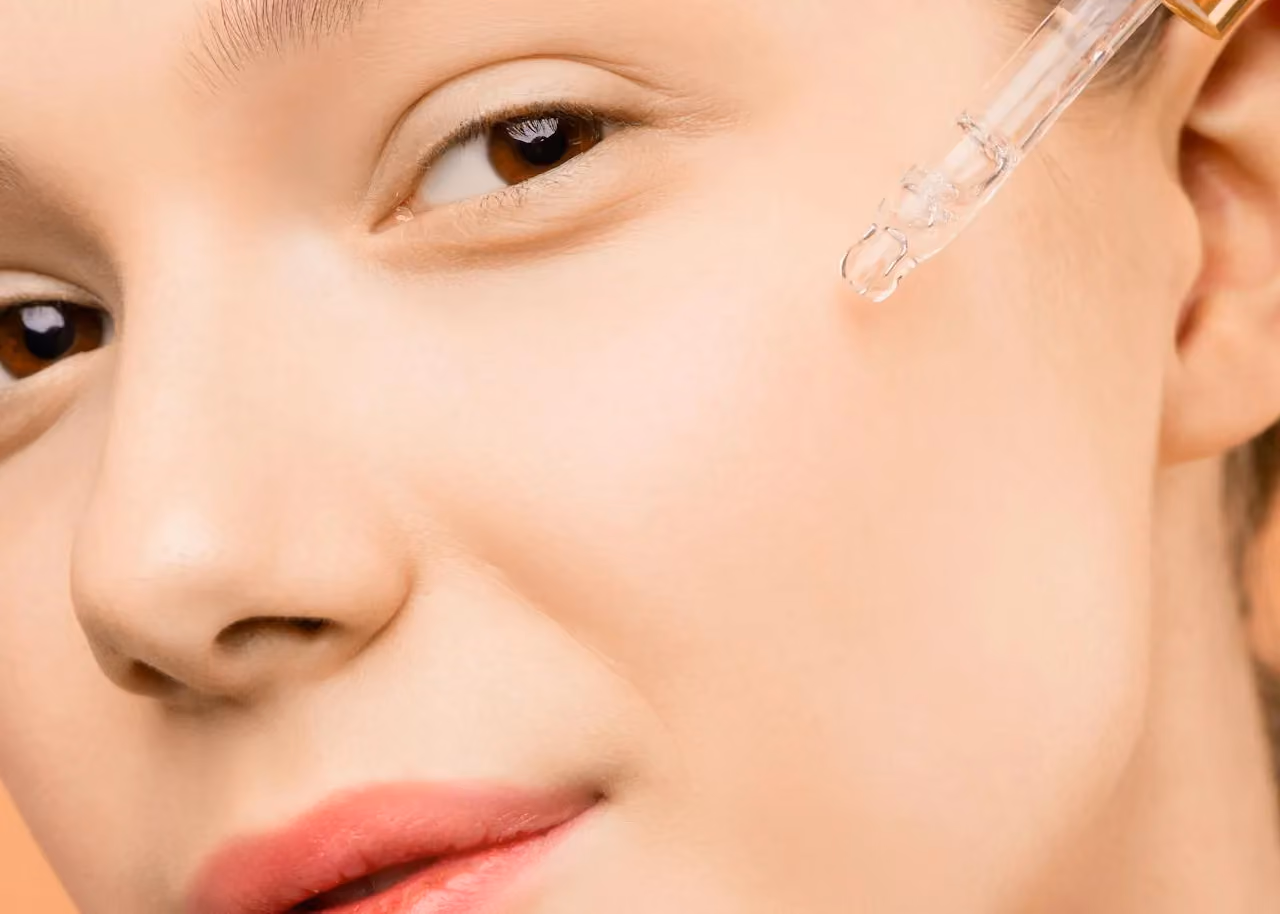 Facial serum applied with a dropper to support healthy-looking skin