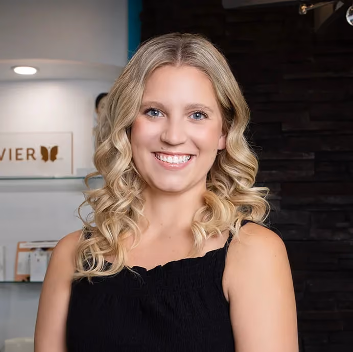 Kaesha Sawicki, Medical Office Assistant welcoming patients at New Light Laser