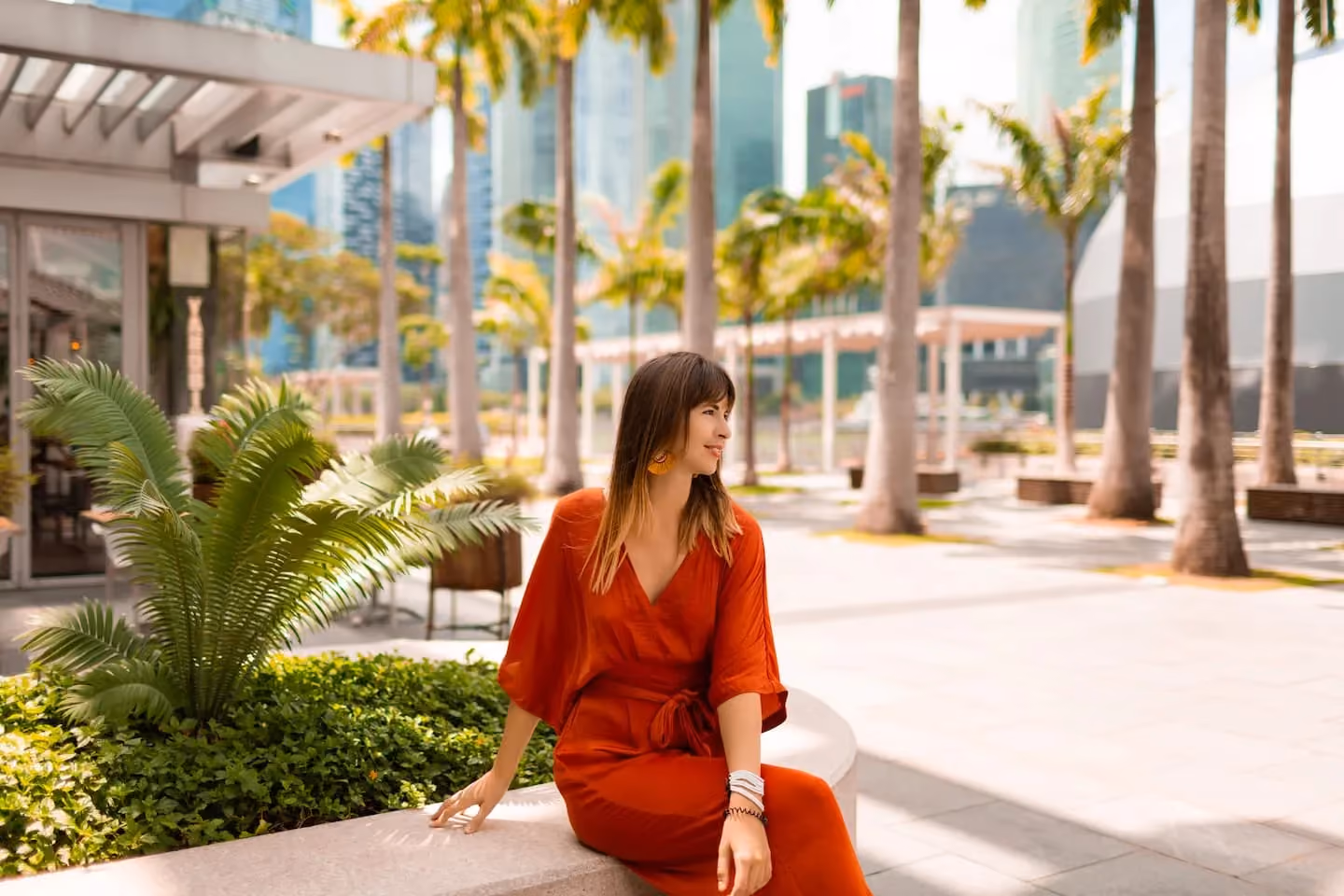 Woman enjoying clear, healthy-looking skin in an outdoor urban setting