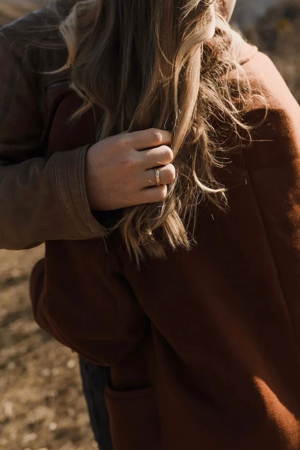Image of a hand holding a long beautiful hair