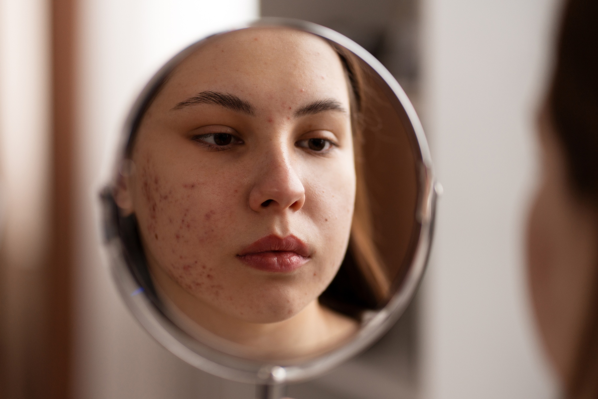 Image of a woman looking in a mirror