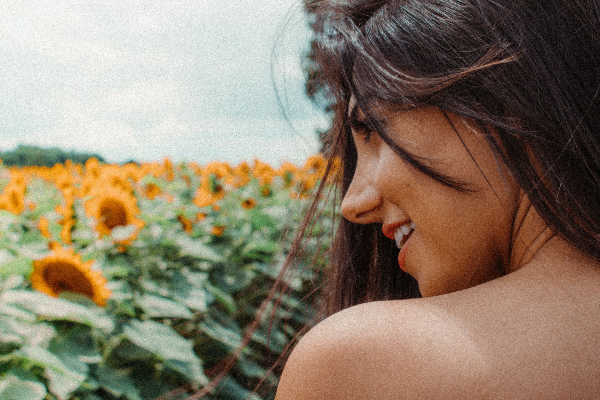 Woman in a field of sunflowers