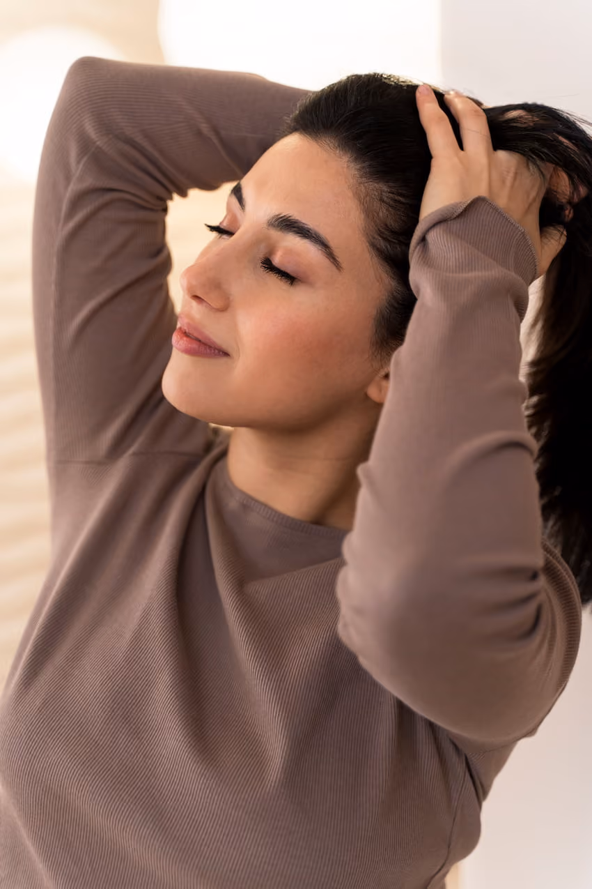 A woman holding her hair