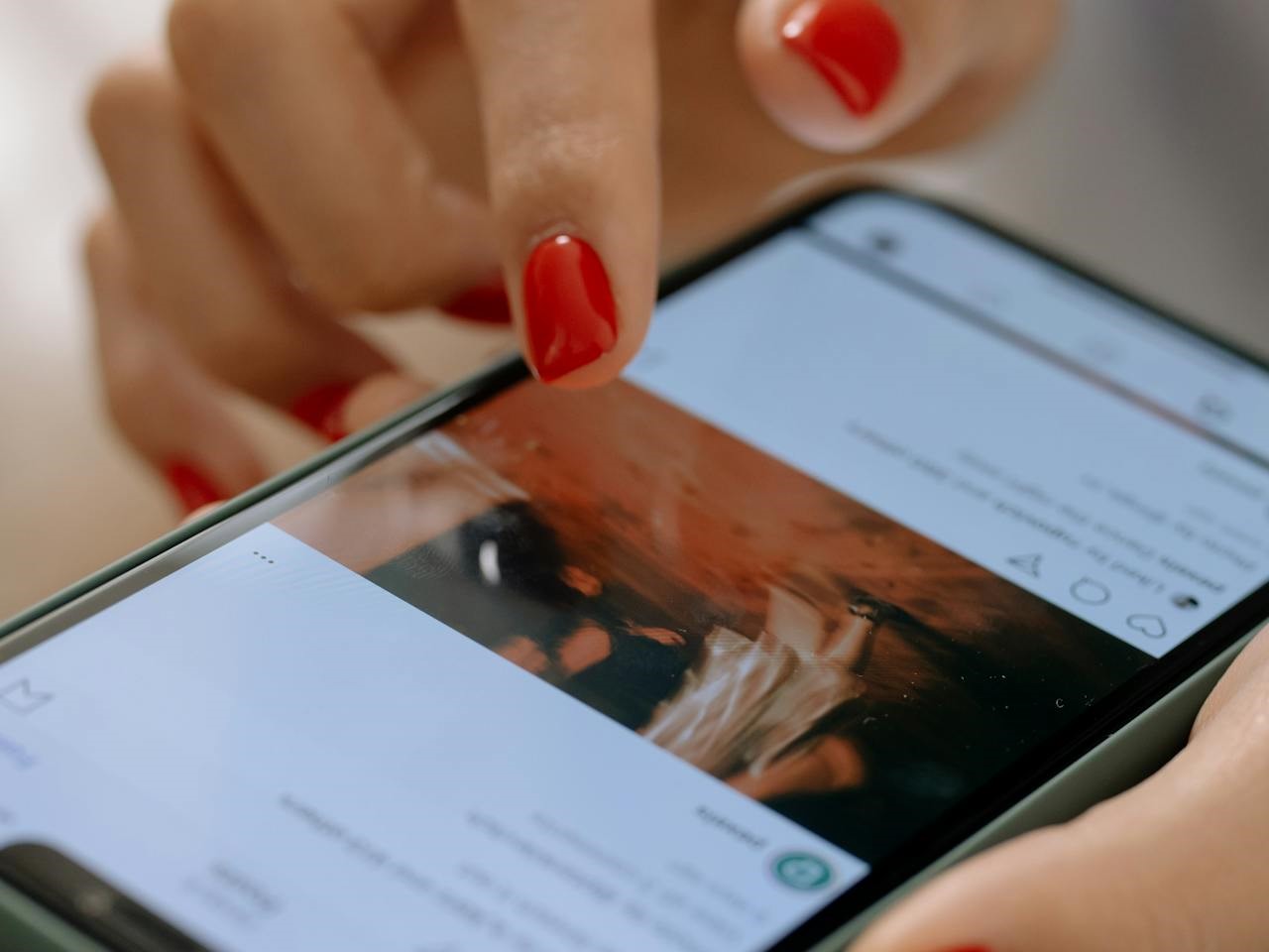 a woman seeing an Instagram post on her phone