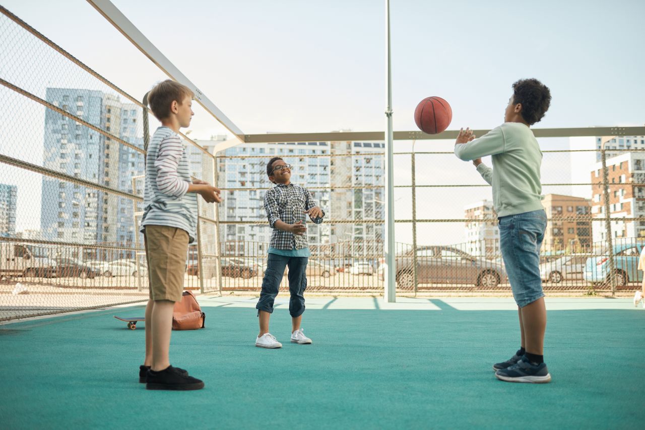 kids playing basketball at an after-school activity programme