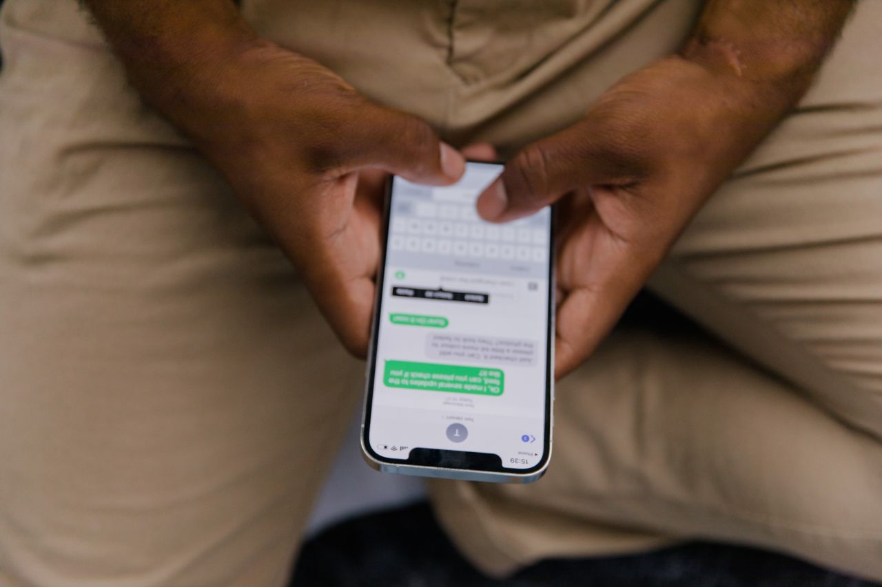 a person chatting with someone on the iMessage application on their phone