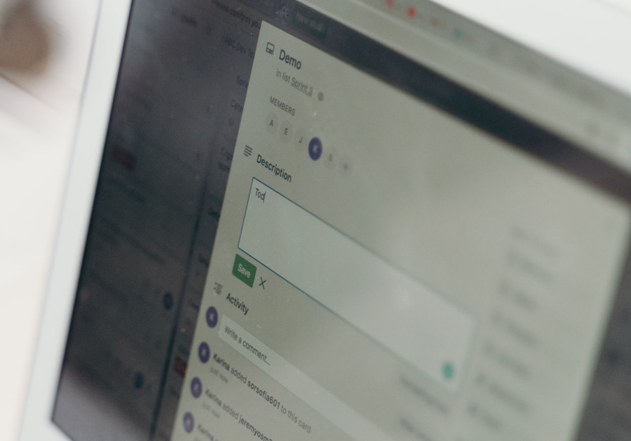 Close-up of a laptop screen showing a data being entered on a lead management system