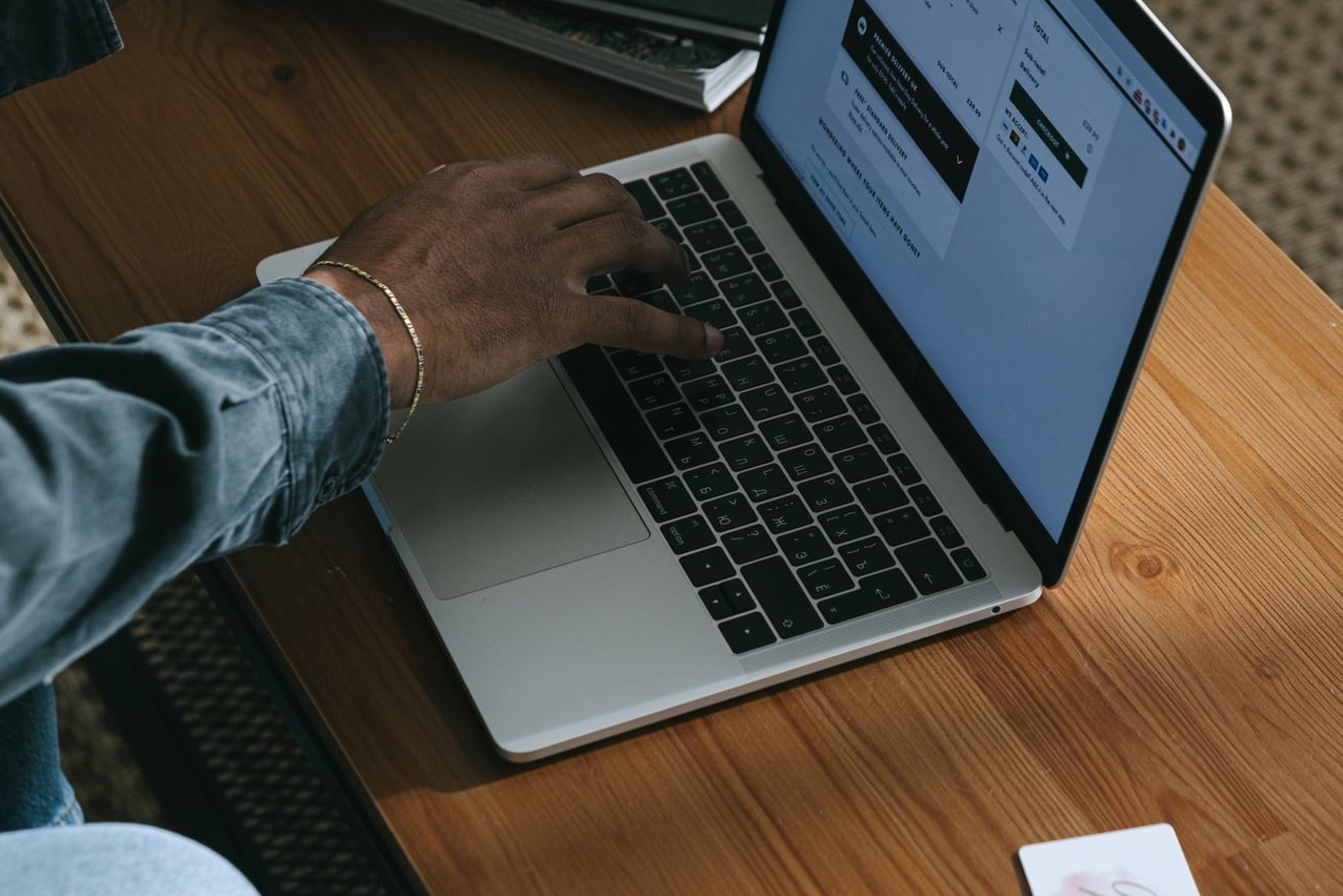 Person using a laptop for online booking