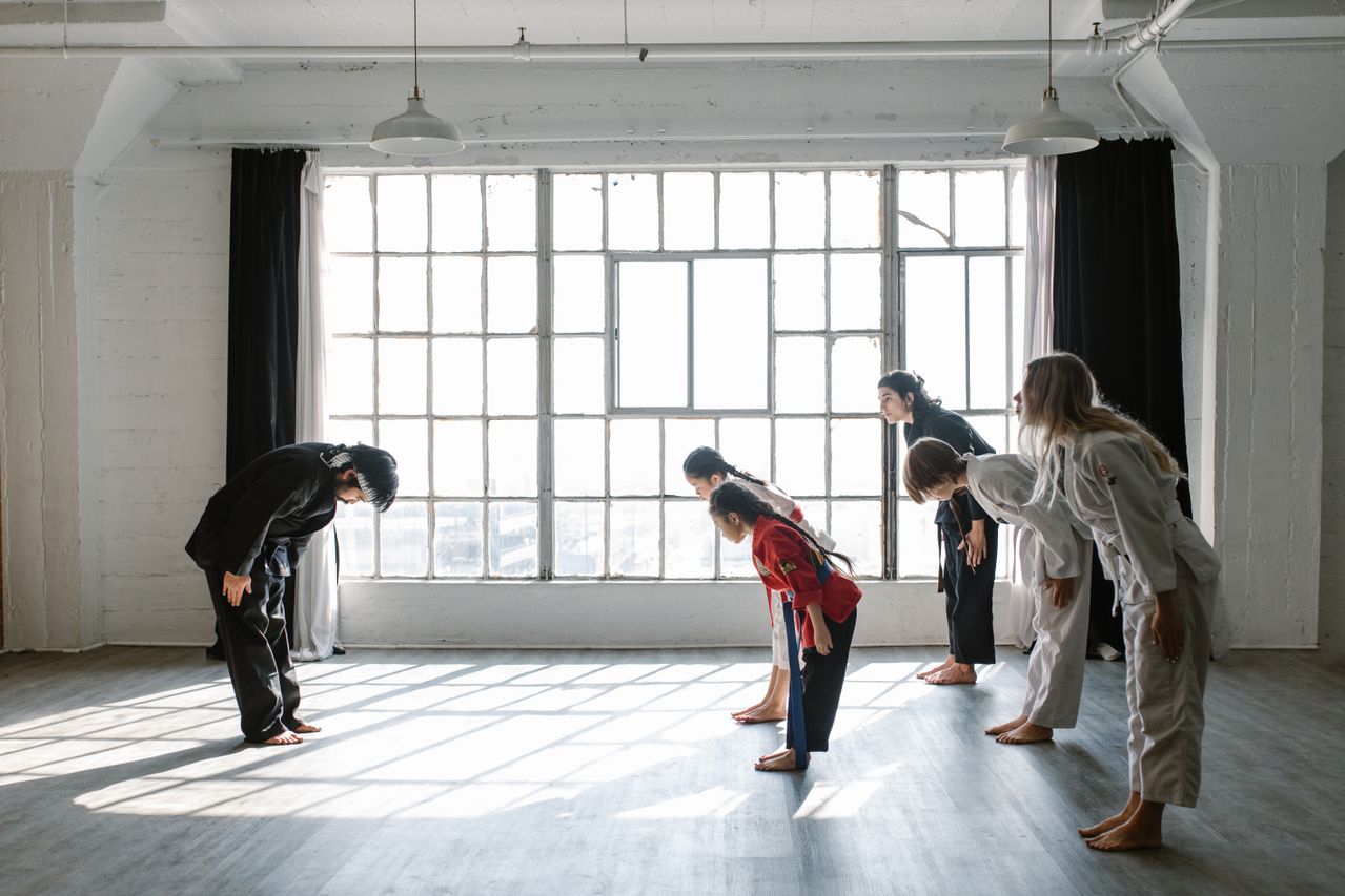 Martial arts students bowing at the start of class