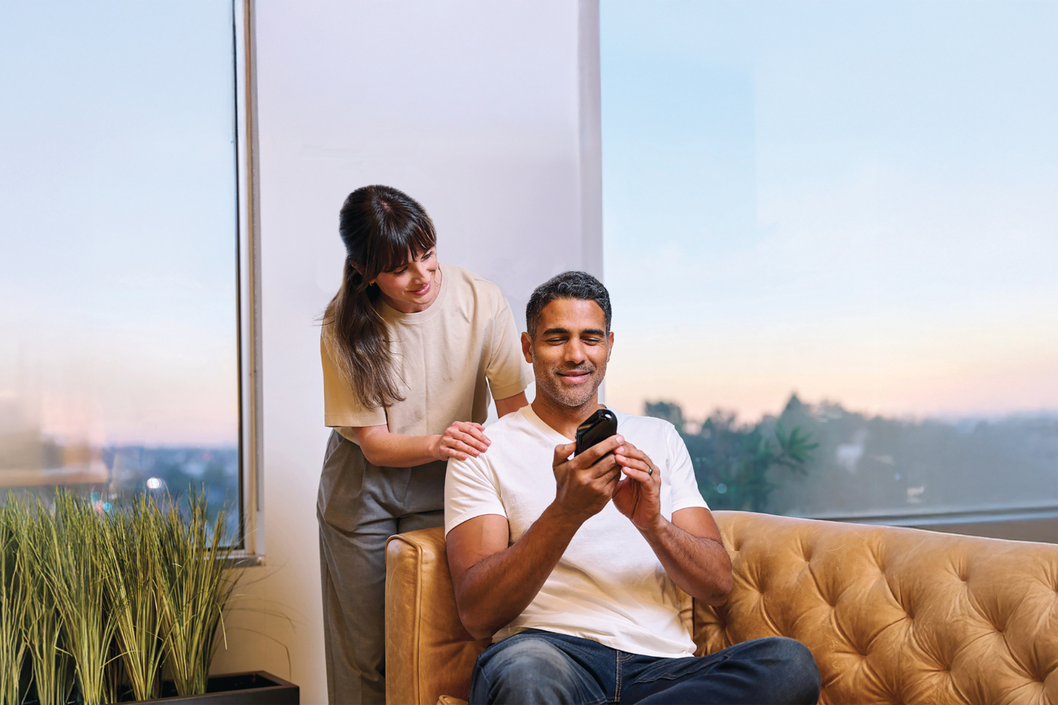 A young couple is testing the Soberlink device at home