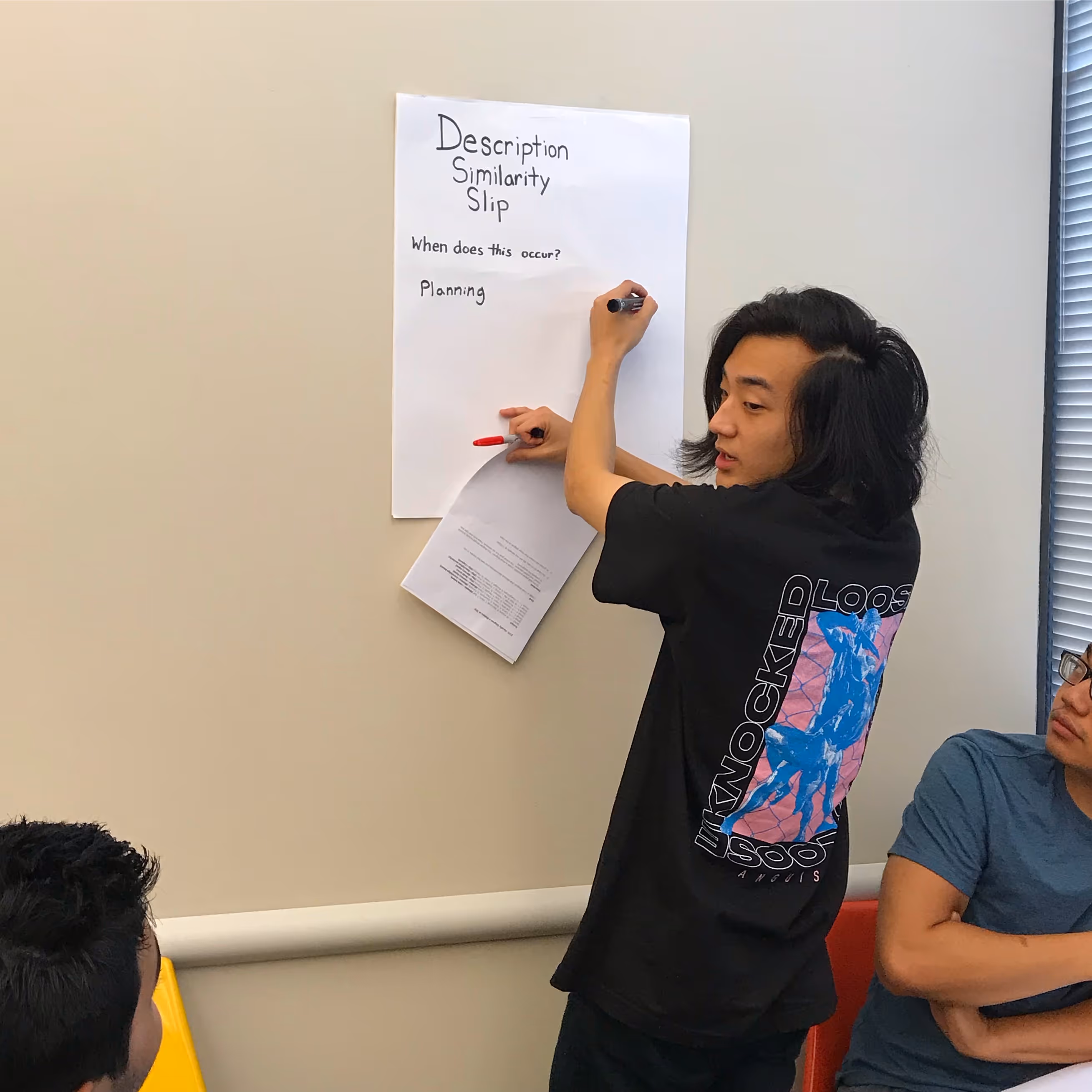 An image of a student working on a design-related exercise.