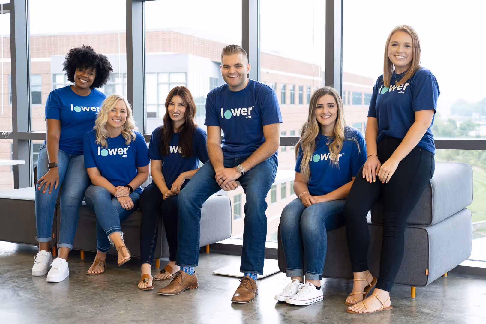 6 Lower.com employees smile for a photo
