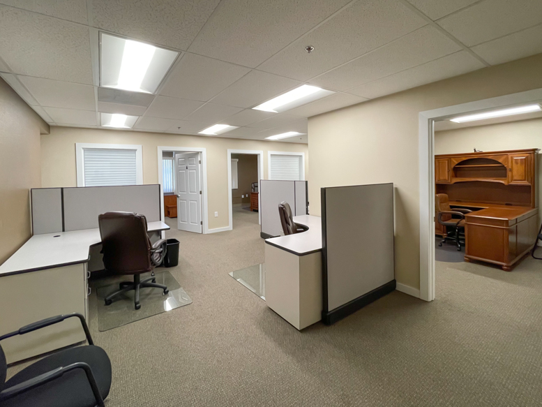 Suite 205 looking in from doorway, one office on the right, two other offices along far wall.
