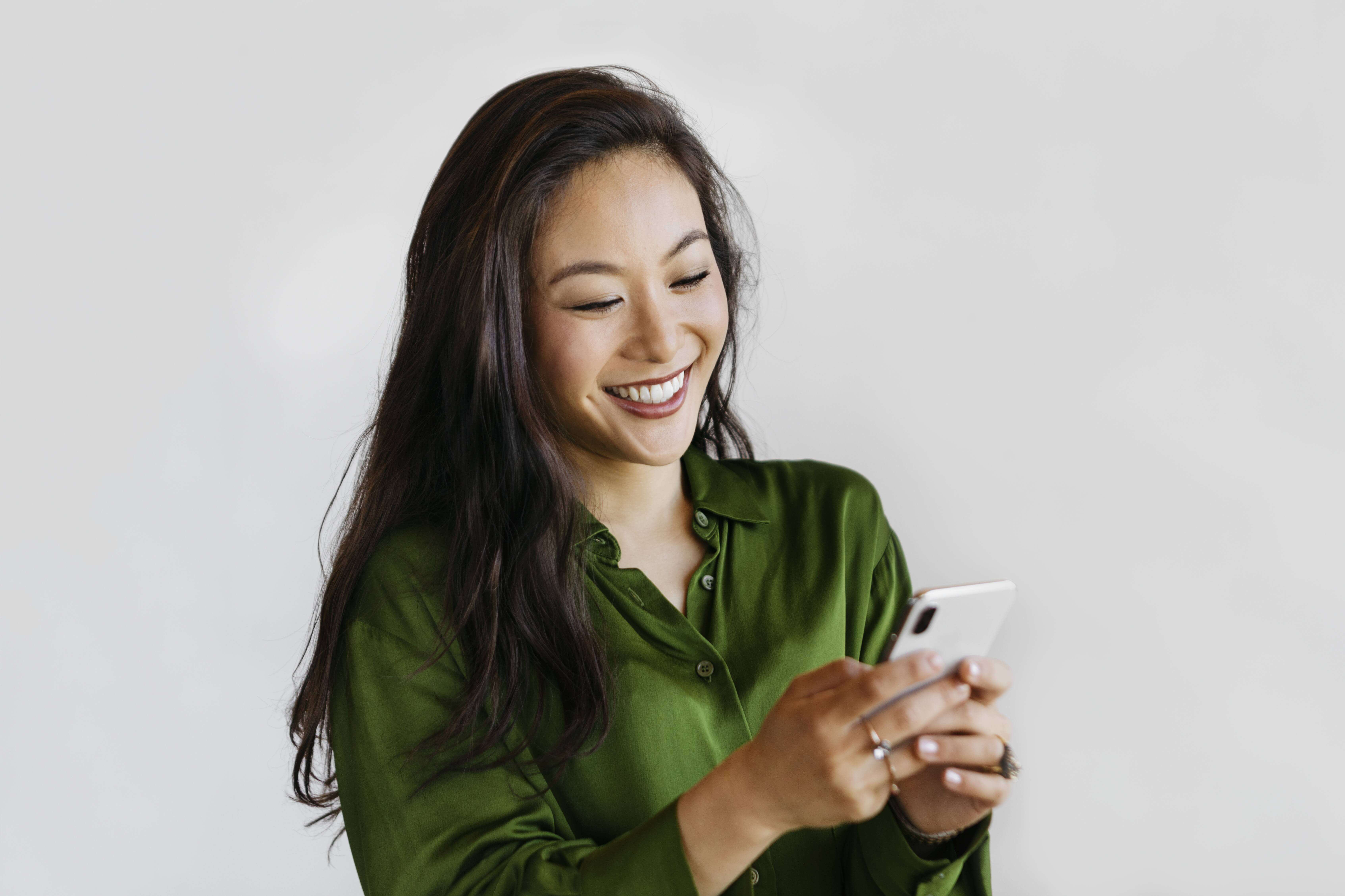 woman on her phone smiling