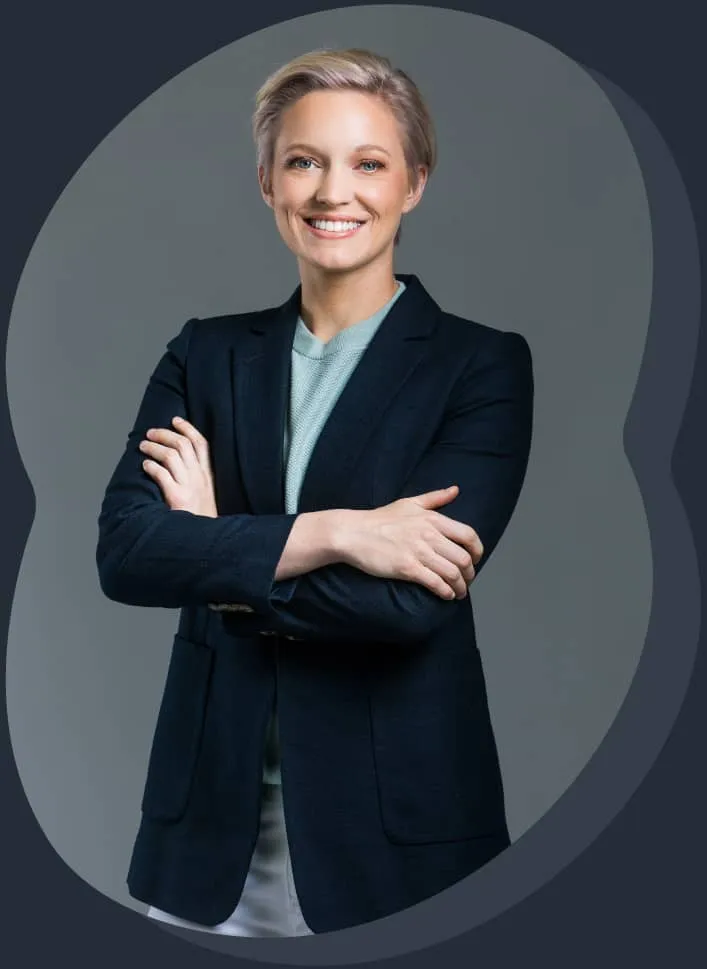 A woman wearing a suit and smiling.