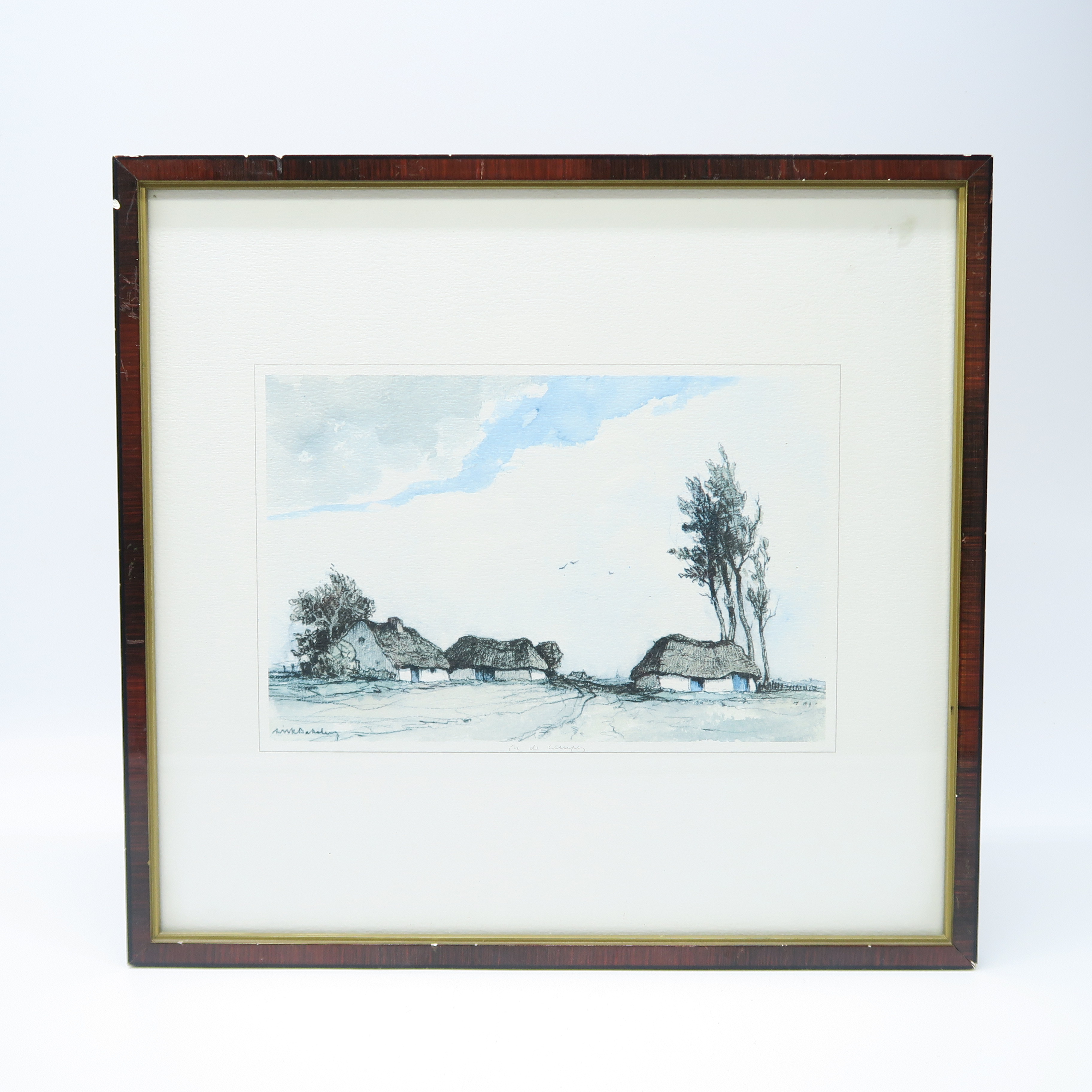 cadre brun et doré et peinture d'un paysage de campagne 