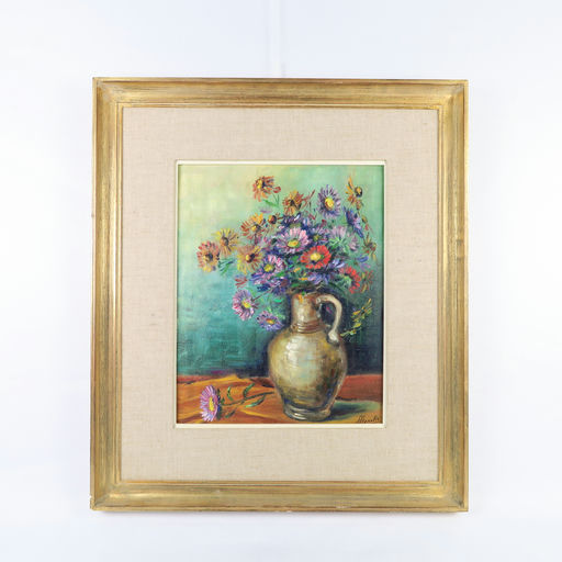 cadre doré et peinture d'un bouquet de fleurs 