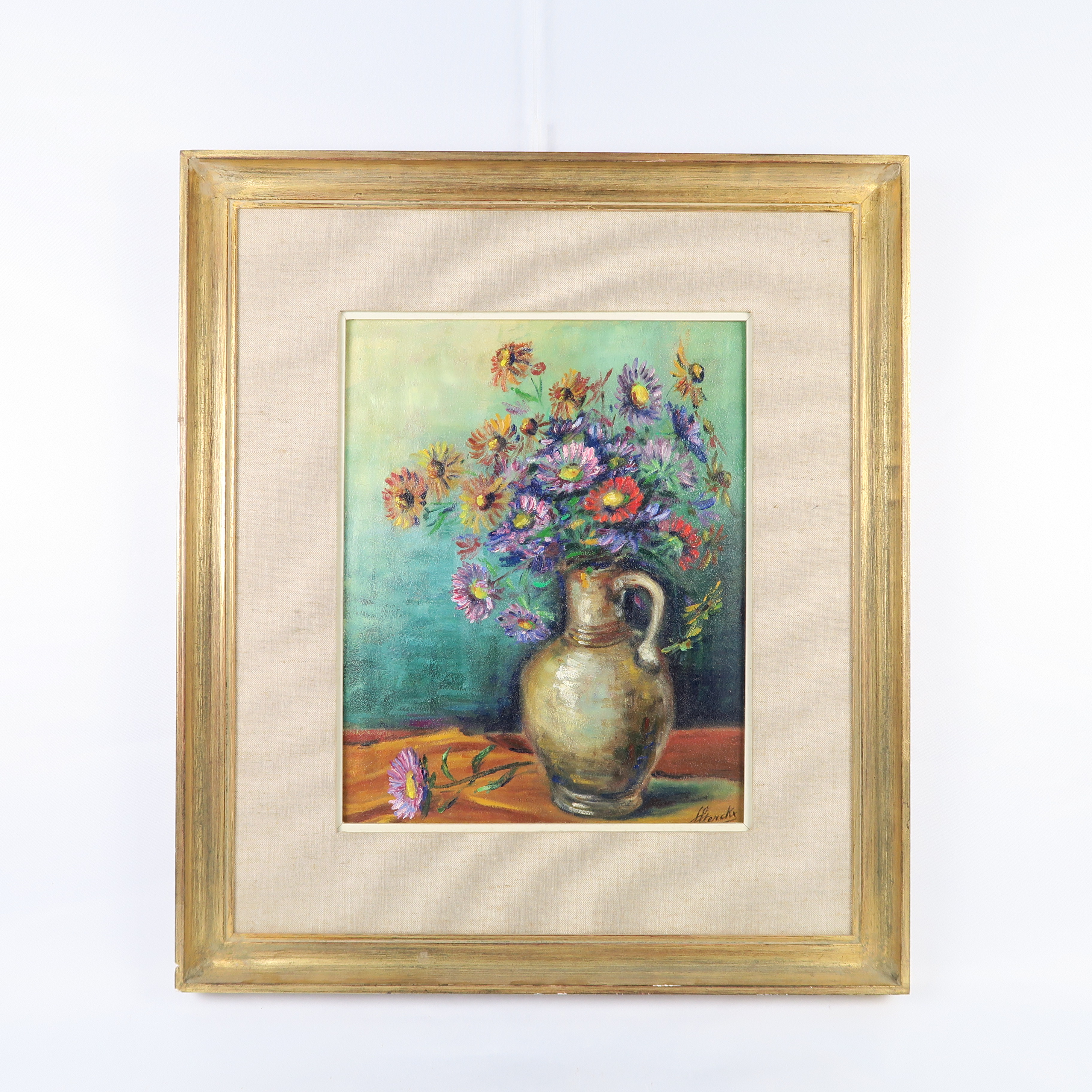 cadre doré et peinture d'un bouquet de fleurs 