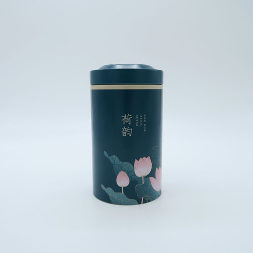 boîte de thé en métal bleu et fleurs roses