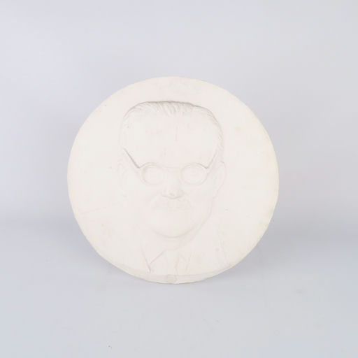 bas relief circulaire en plâtre portrait d'un homme
