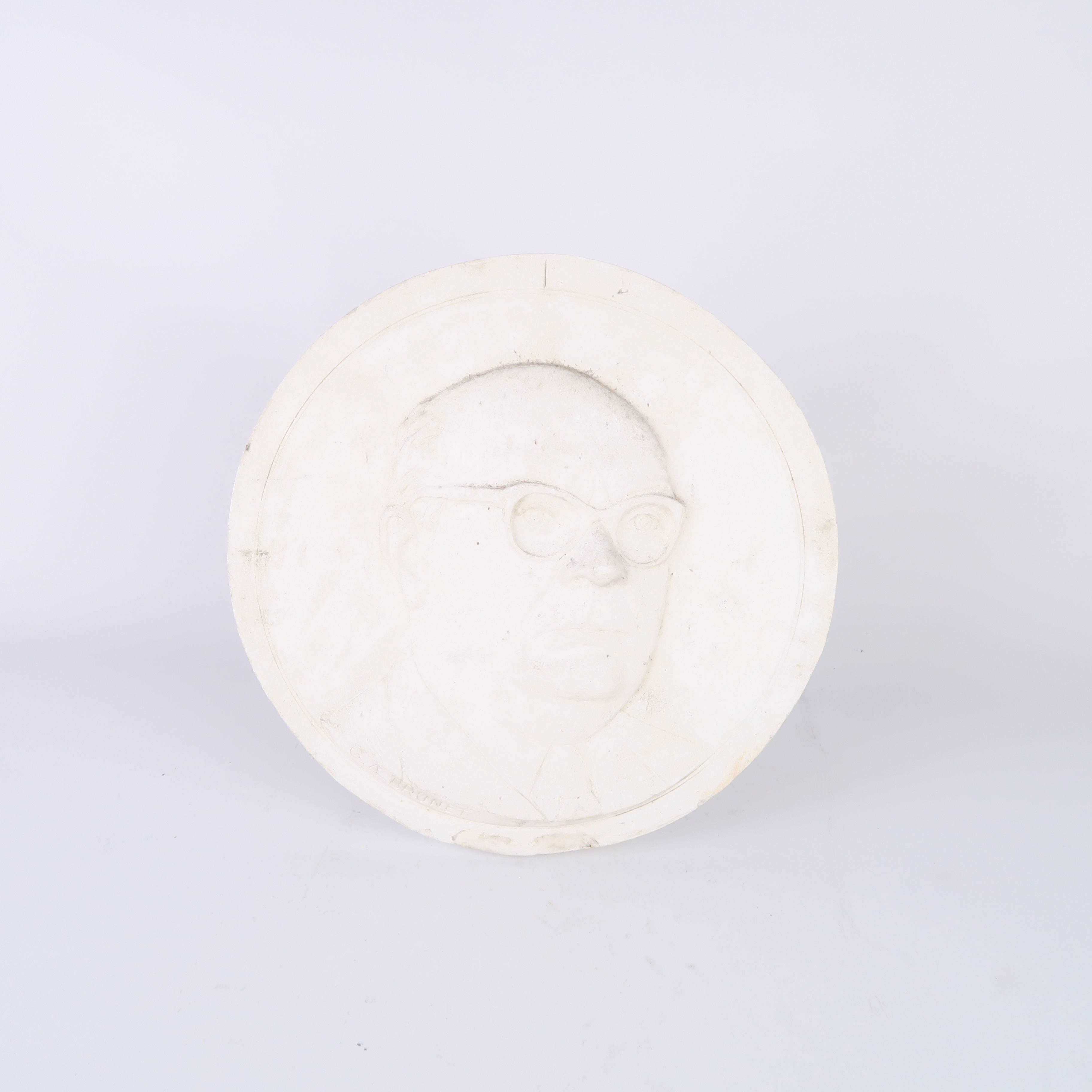 bas relief circulaire en plâtre portrait d'un homme signé 'g.a. brunet'