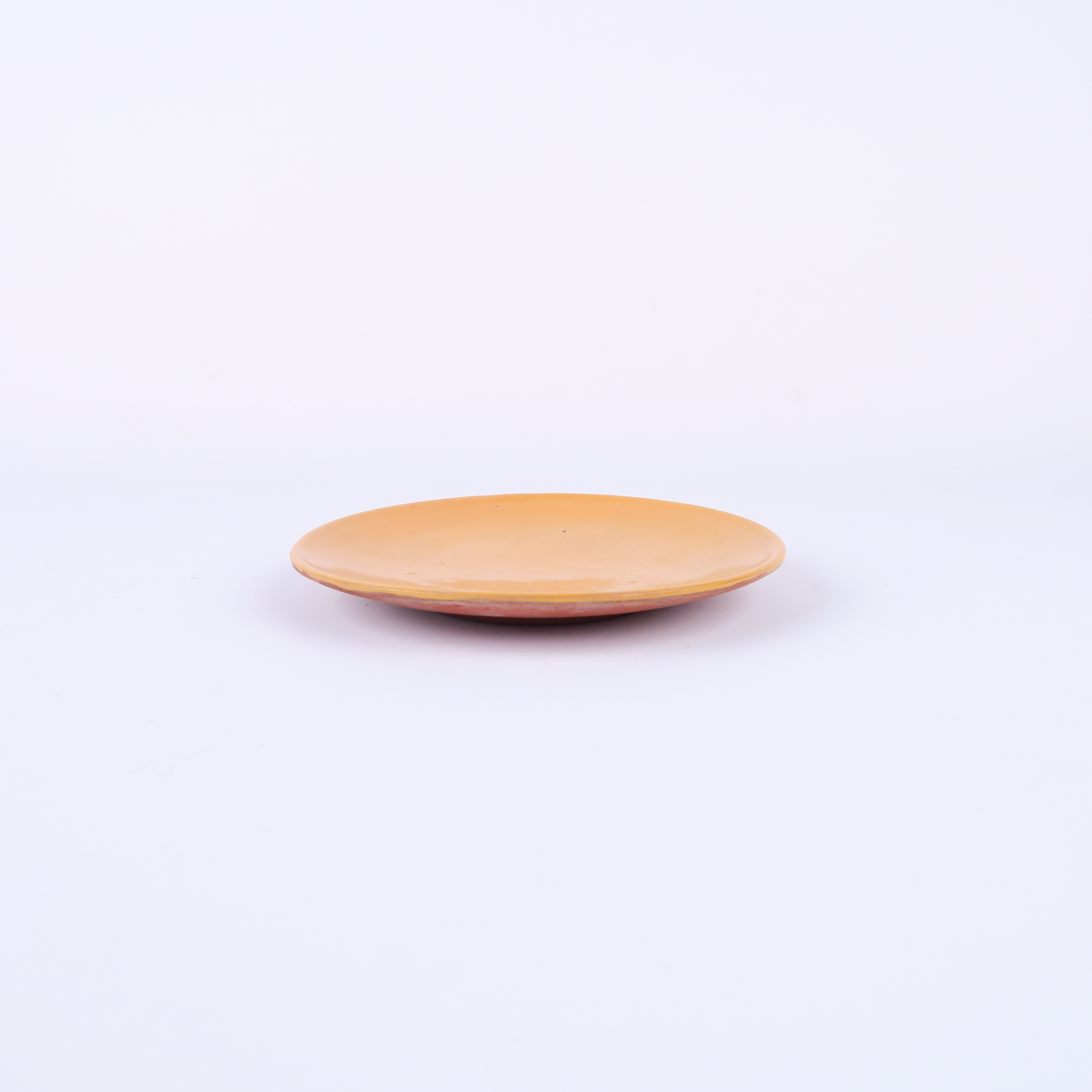 assiette en terre cuite et émaille orange