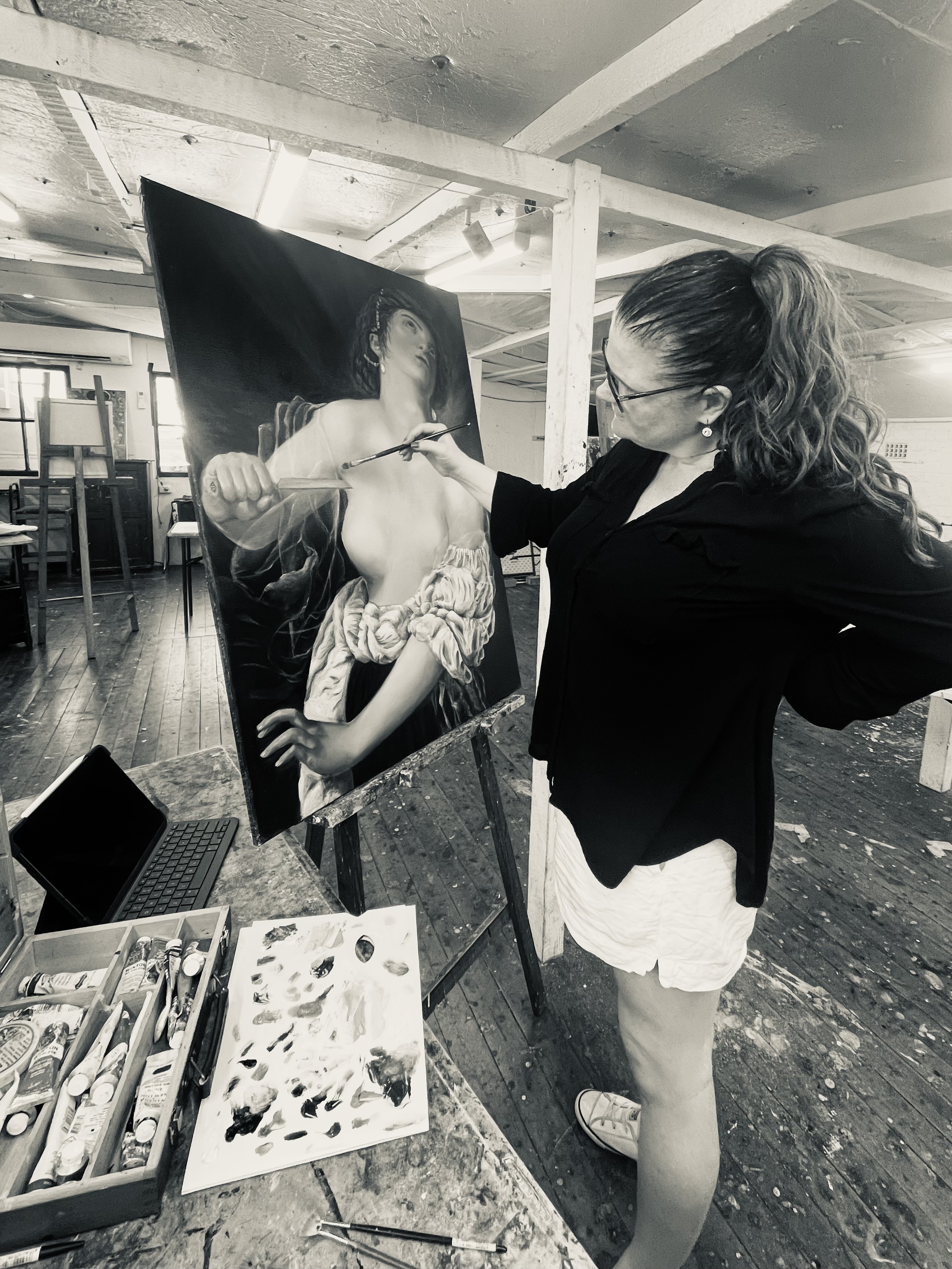 Fiona mearon in the studio painting a large oil painting