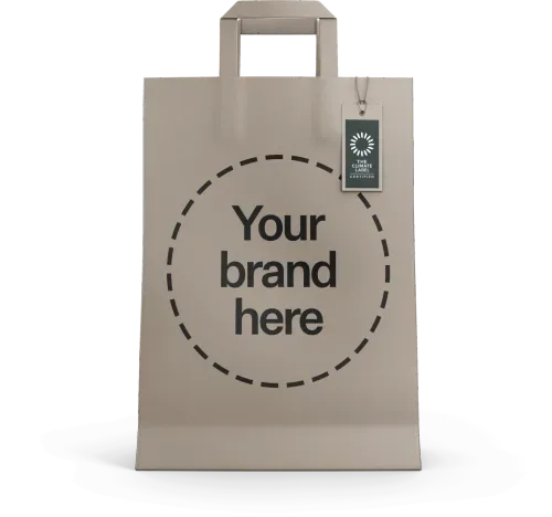 Mockup of a paper bag with the climate neutral certified label and a message reading "Your brand here".