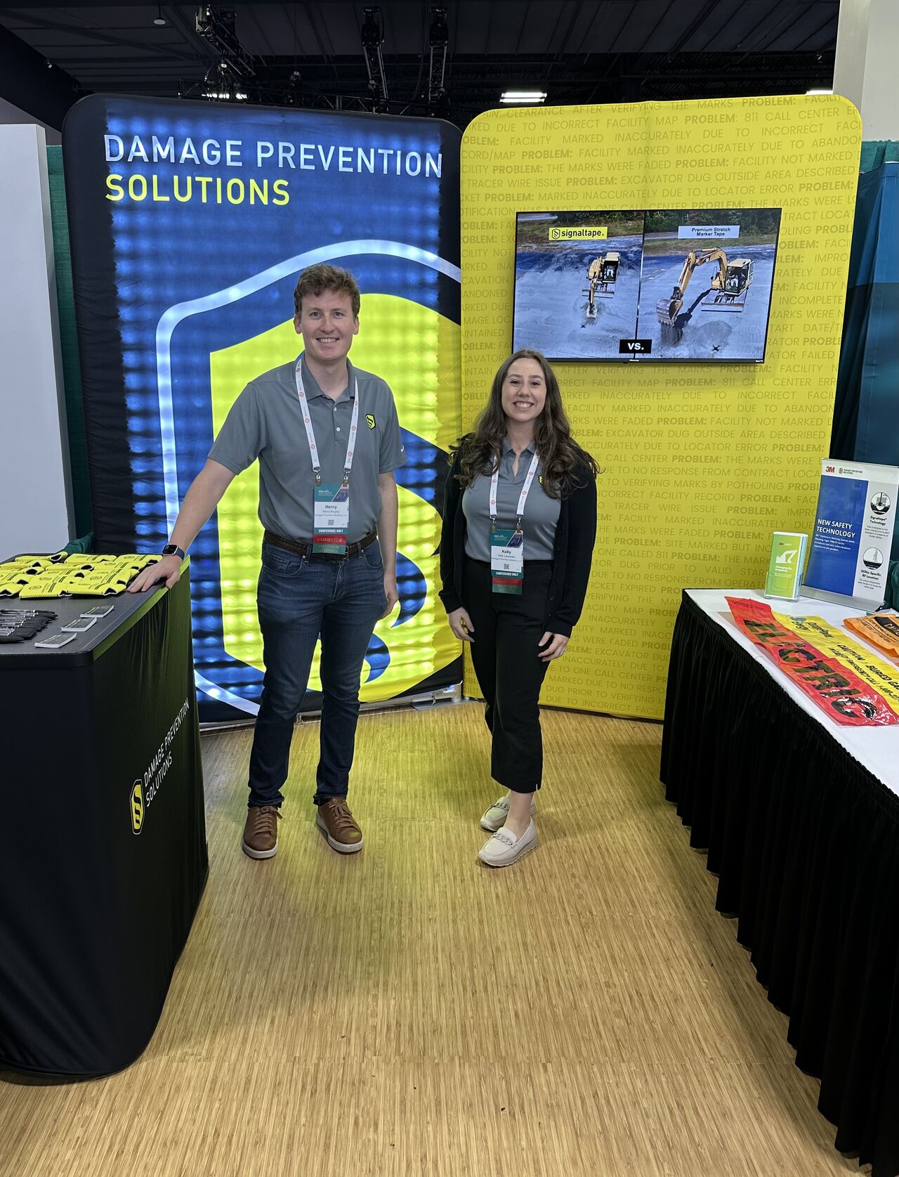 Image of Henry Brophy and Kelly Carpenter in the Damage Prevention Solutions booth at AGA