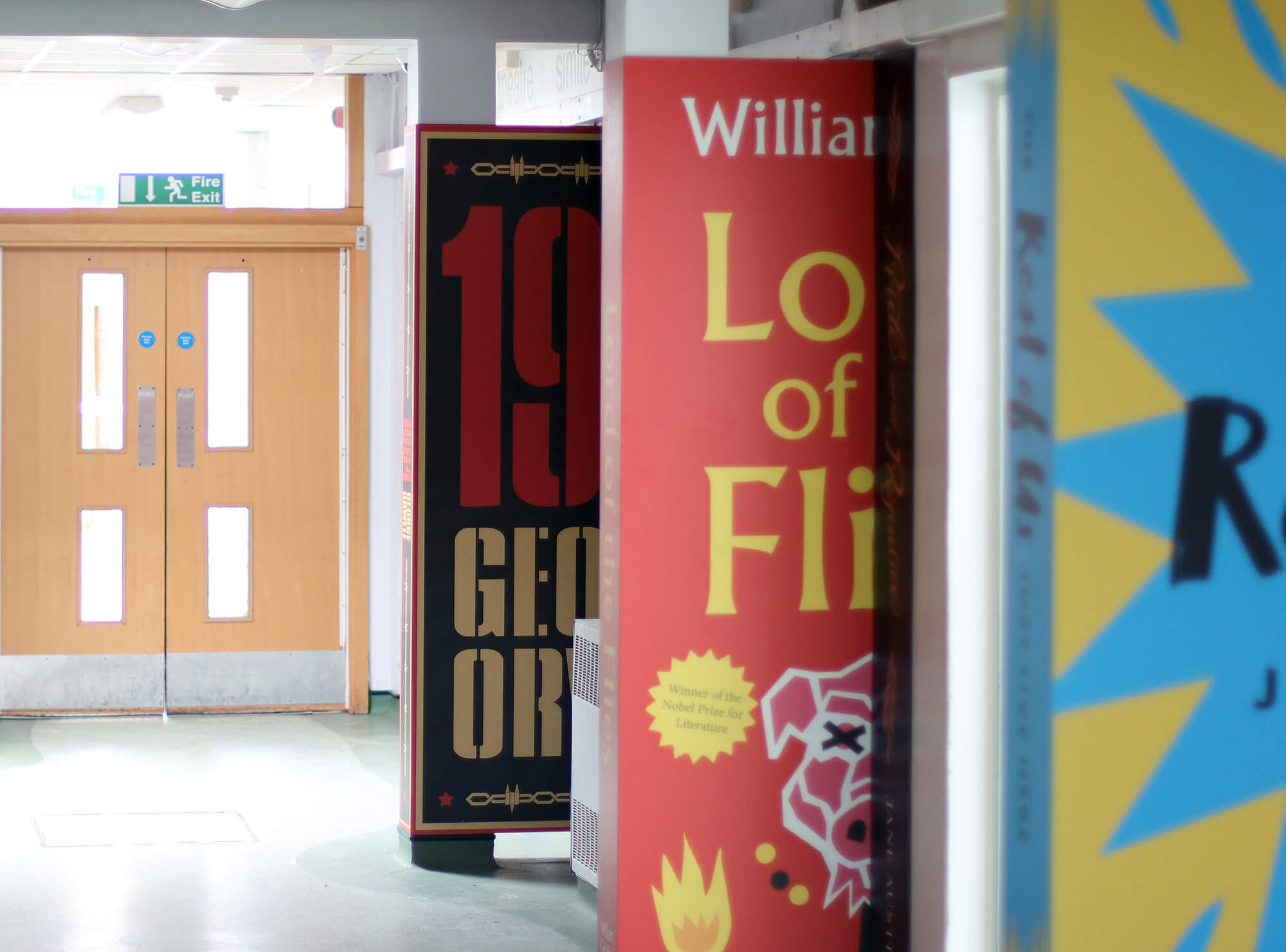 This immersive corridor wall art at Lutterworth High School was designed for the English department, featuring life-sized books that encourage students to pick up a book and read. The vibrant design can be customised to showcase your favourite stories, making it an ideal addition to school corridors and library spaces. Perfect for creating an inspiring and engaging environment for students to explore literature.