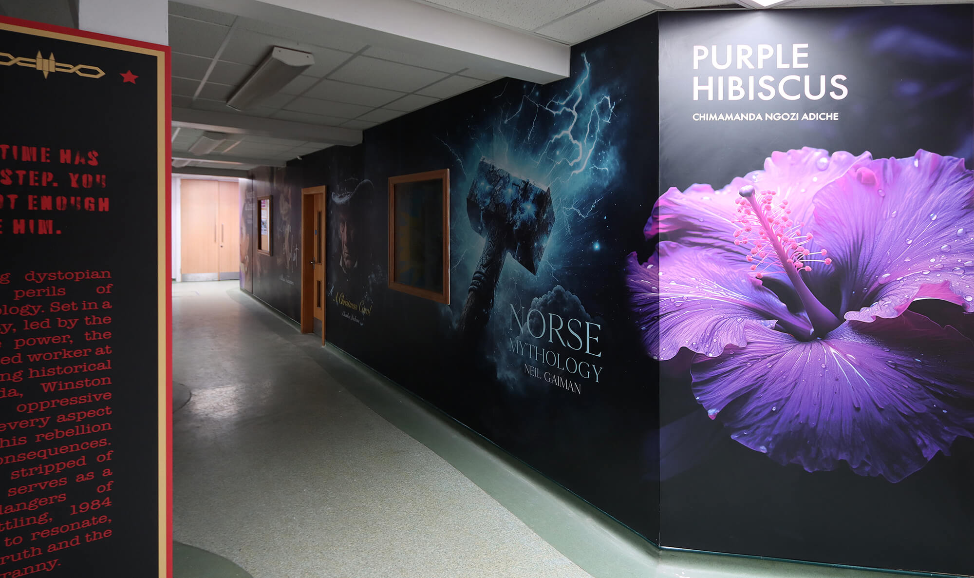 This captivating Wall Art at Lutterworth High School demonstrates how dark colours can be used to set the mood of educational graphics, perfect for themes like a mysterious novel or Norse mythology. The striking contrast draws attention to the artwork, sparking curiosity and encouraging students to explore the books featured. A powerful way to create an immersive and thought-provoking environment that motivates students to engage with literature.