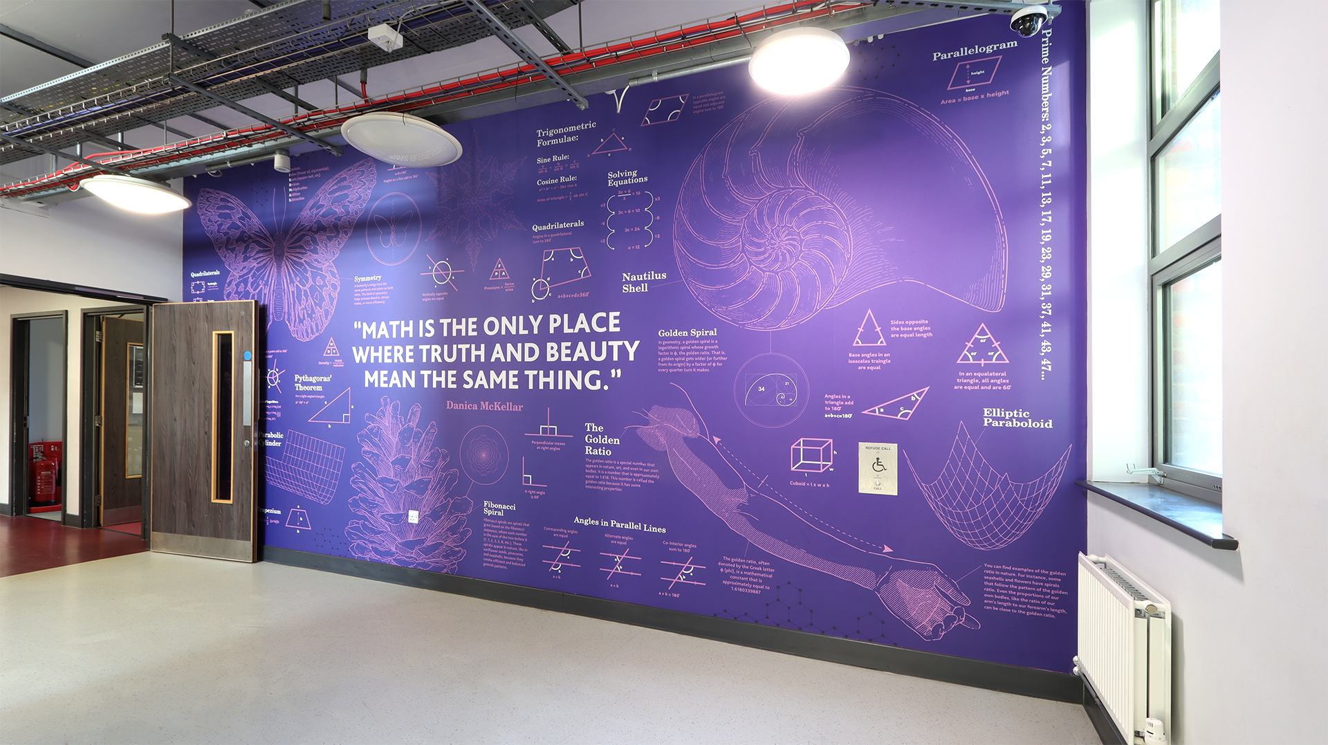 Enhance your school’s learning environment with a maths blueprint wall mural that turns education into art. Designed to inspire curiosity and support visual learning, this display combines STEM-focused graphics, geometry, and algebraic formulas with clean architectural blueprint design. Tailor-made for classrooms and corridors, it can be personalised to your school’s branding and curriculum.