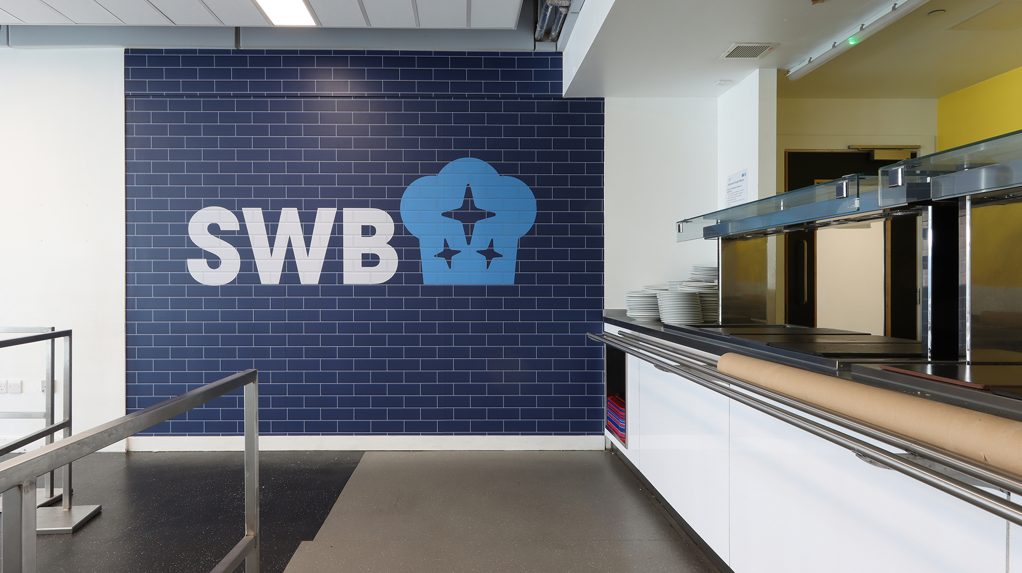 This high-impact brand display grabs attention instantly and is perfect for transforming large school spaces such as canteens, entrance halls and corridors. Powerful, modern and high-energy visuals help reinforce school identity, spark pride and create a memorable environment for students, staff and visitors. Ideal for schools wanting to elevate their brand presence and turn big spaces into vibrant, dynamic focal points.