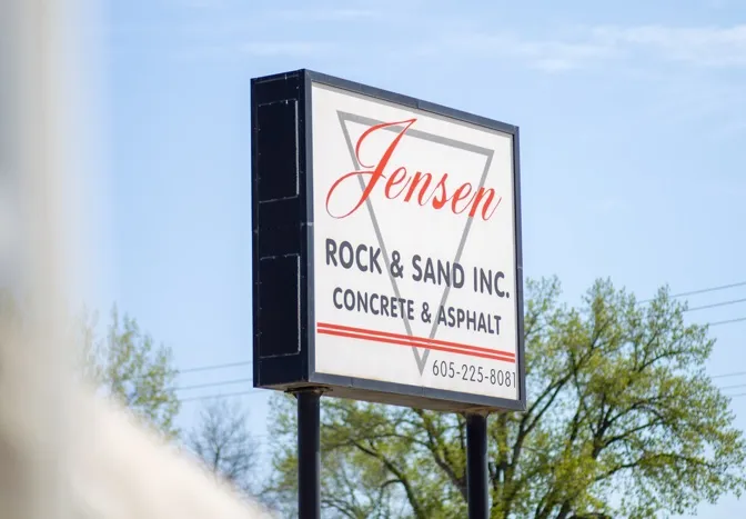 Jensen Rock and Sand sign