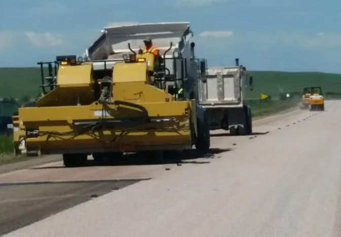 chip seal crew working on a road