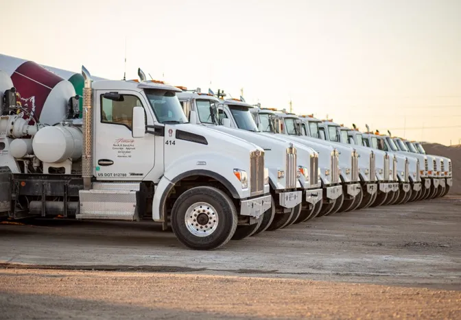jensen concrete trucks parked in a line