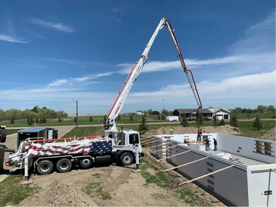 Pump truck pouring new house walls