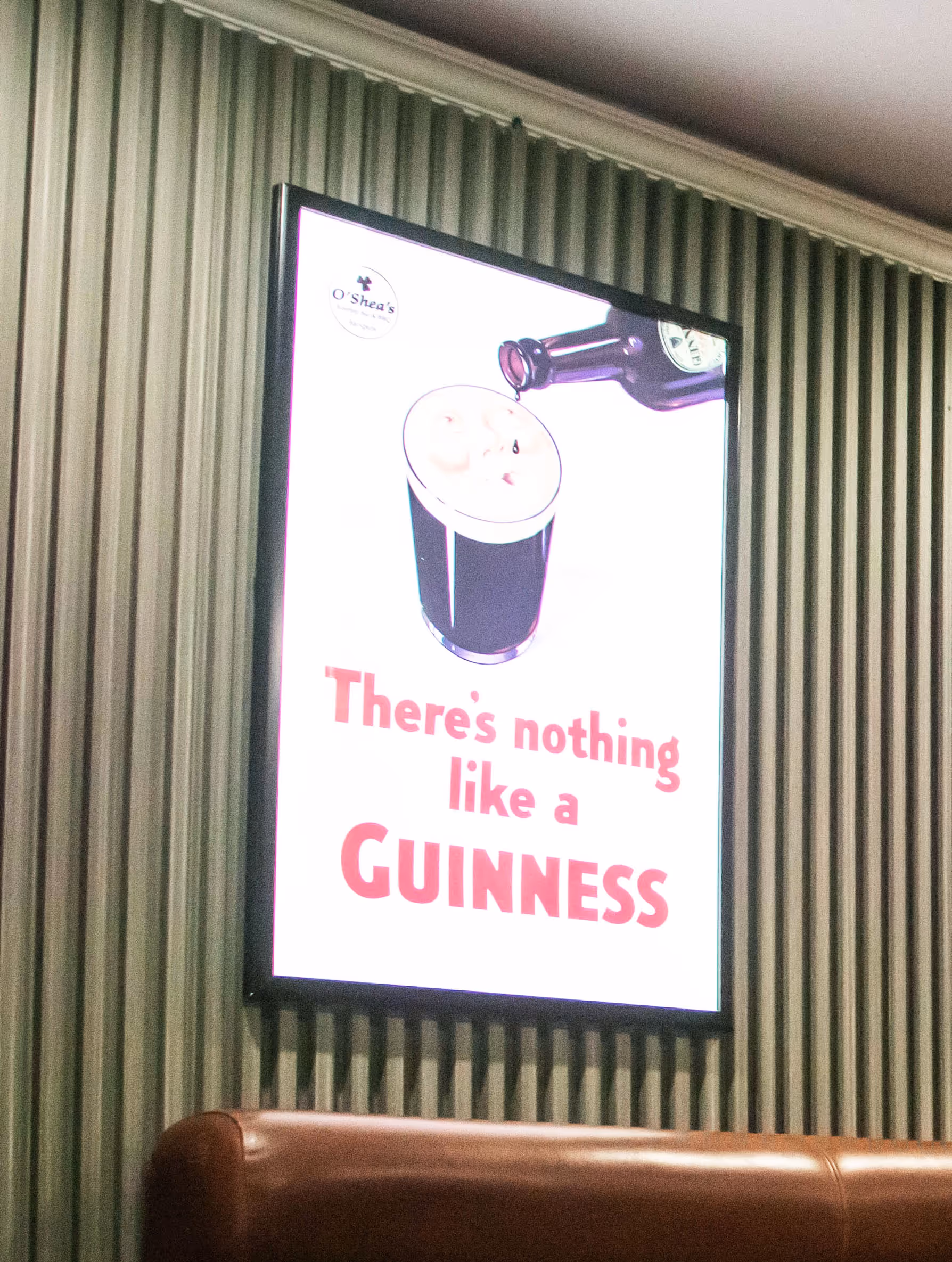 Poster showing beer bottle pouring into a glass with the text: There's nothing like a Guinness.