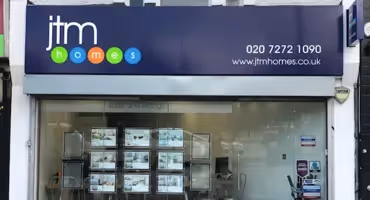Shop front of JTM estate agents in Archway.